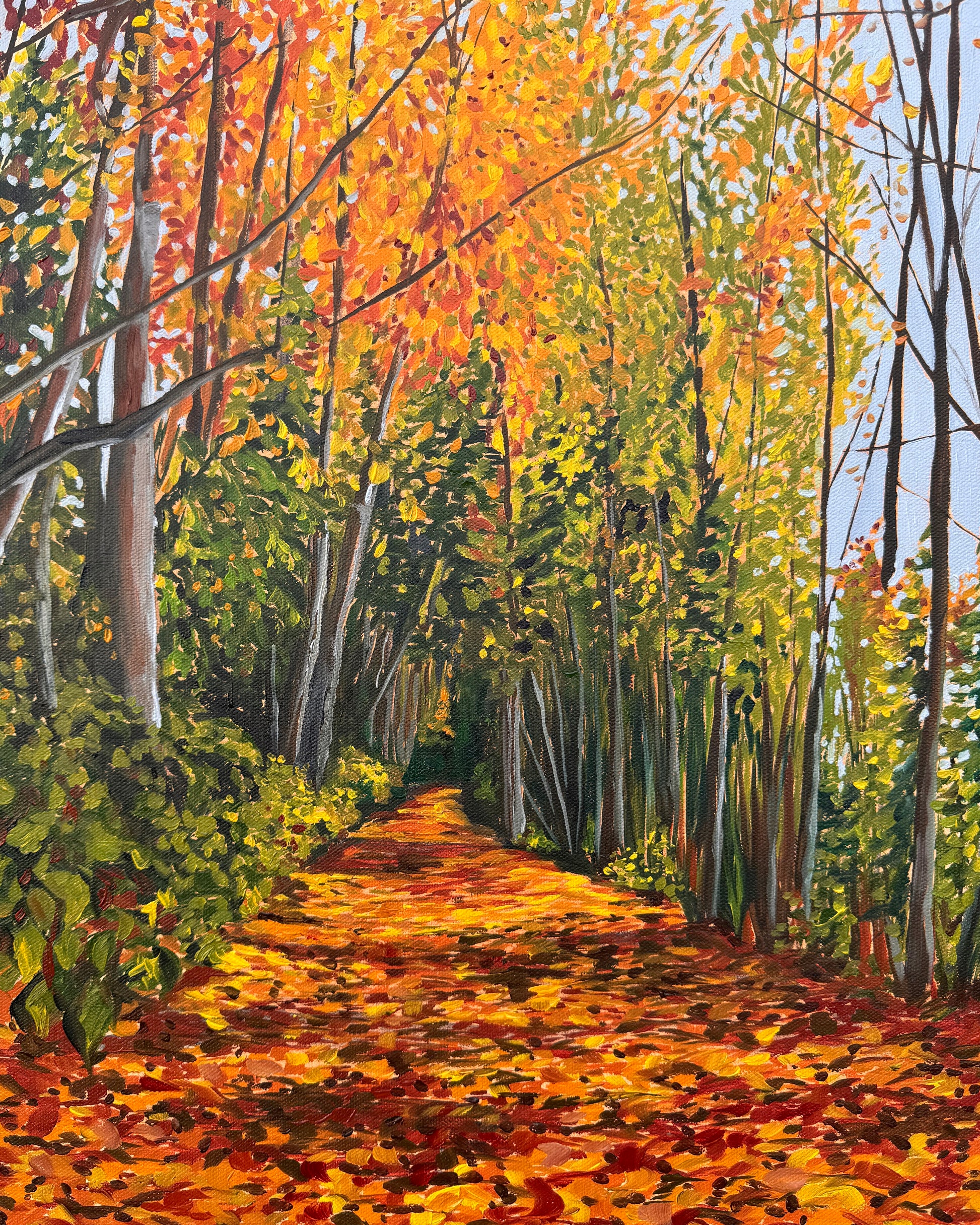 Painting showing a wooded path in the fall, with colorful leaves on the trees and on the ground, by artist AnnMarie Henderson