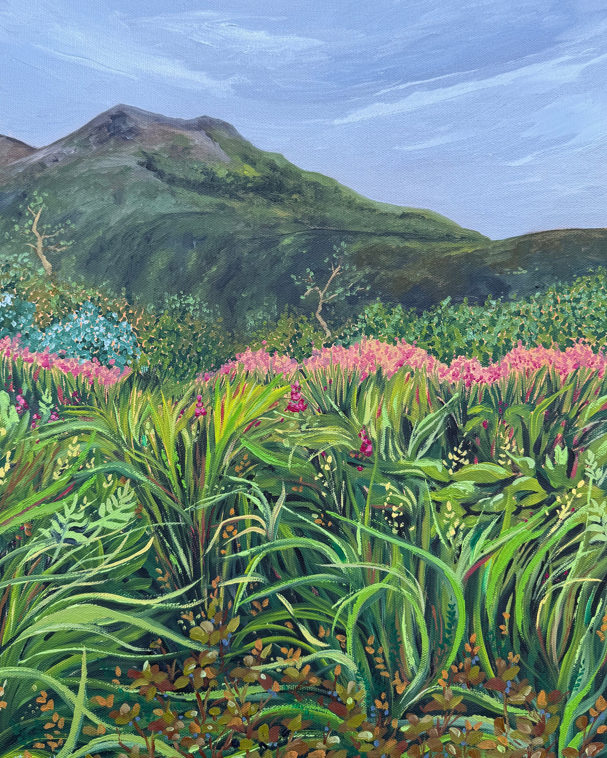 Painting showing a large mountain with brightly colored wildflowers in the foreground by artist AnnMarie Henderson